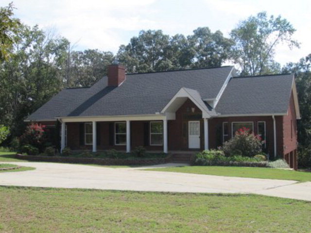 511 Schofill Road Fort Valley, GA 31030 - Photo 1 of 1 a front view of a house with a garden