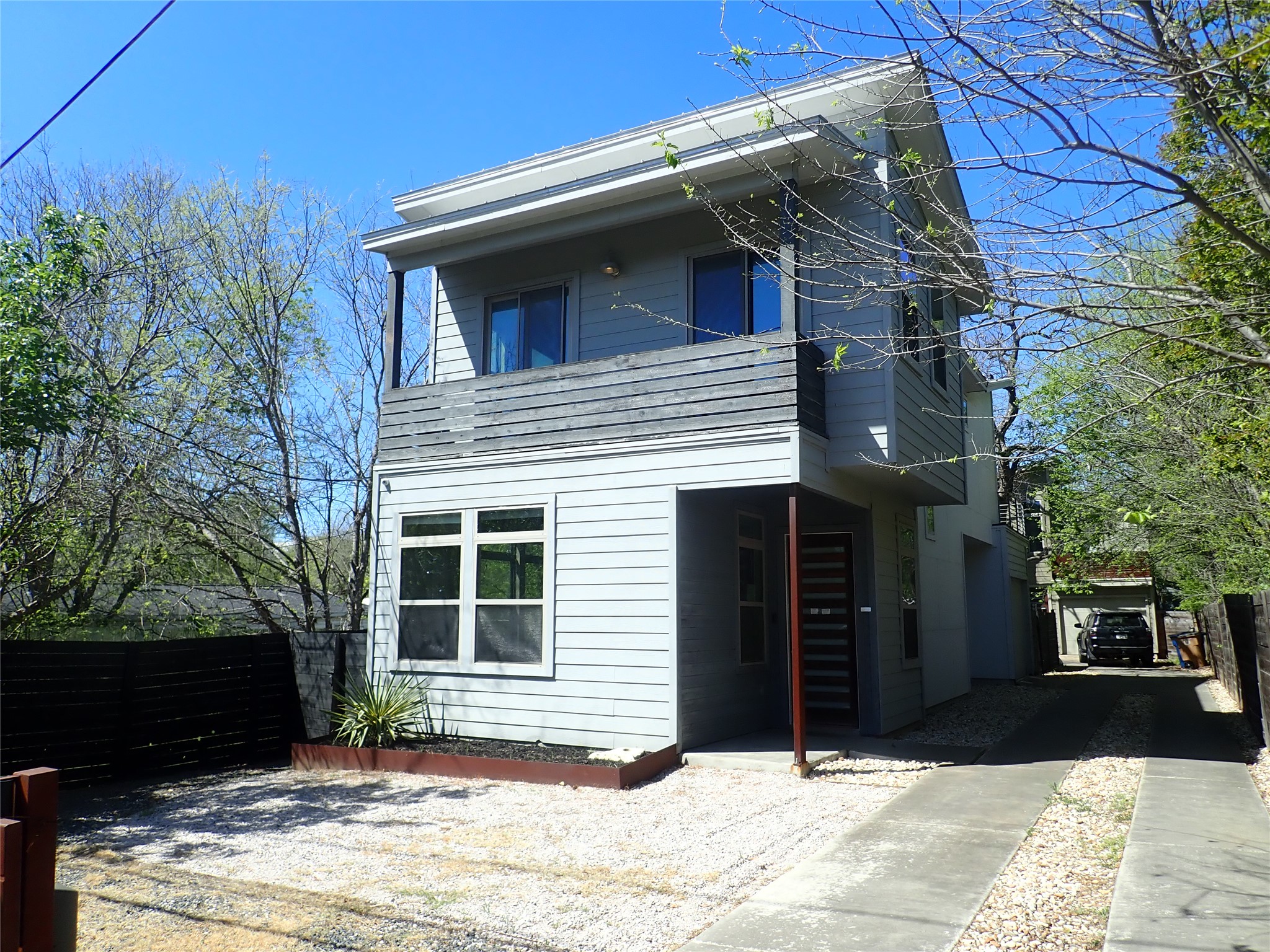 2912 East 14th Street, Unit A Austin, TX 78702 - Photo 1 of 27 View of front facade with a balcony