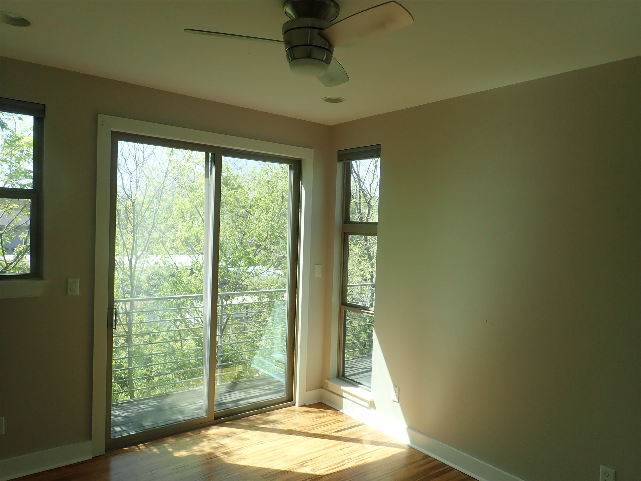 2912 East 14th Street, Unit A Austin, TX 78702 - Photo 14 of 27 Primary Bedroom featuring wood finished floors and ceiling fan