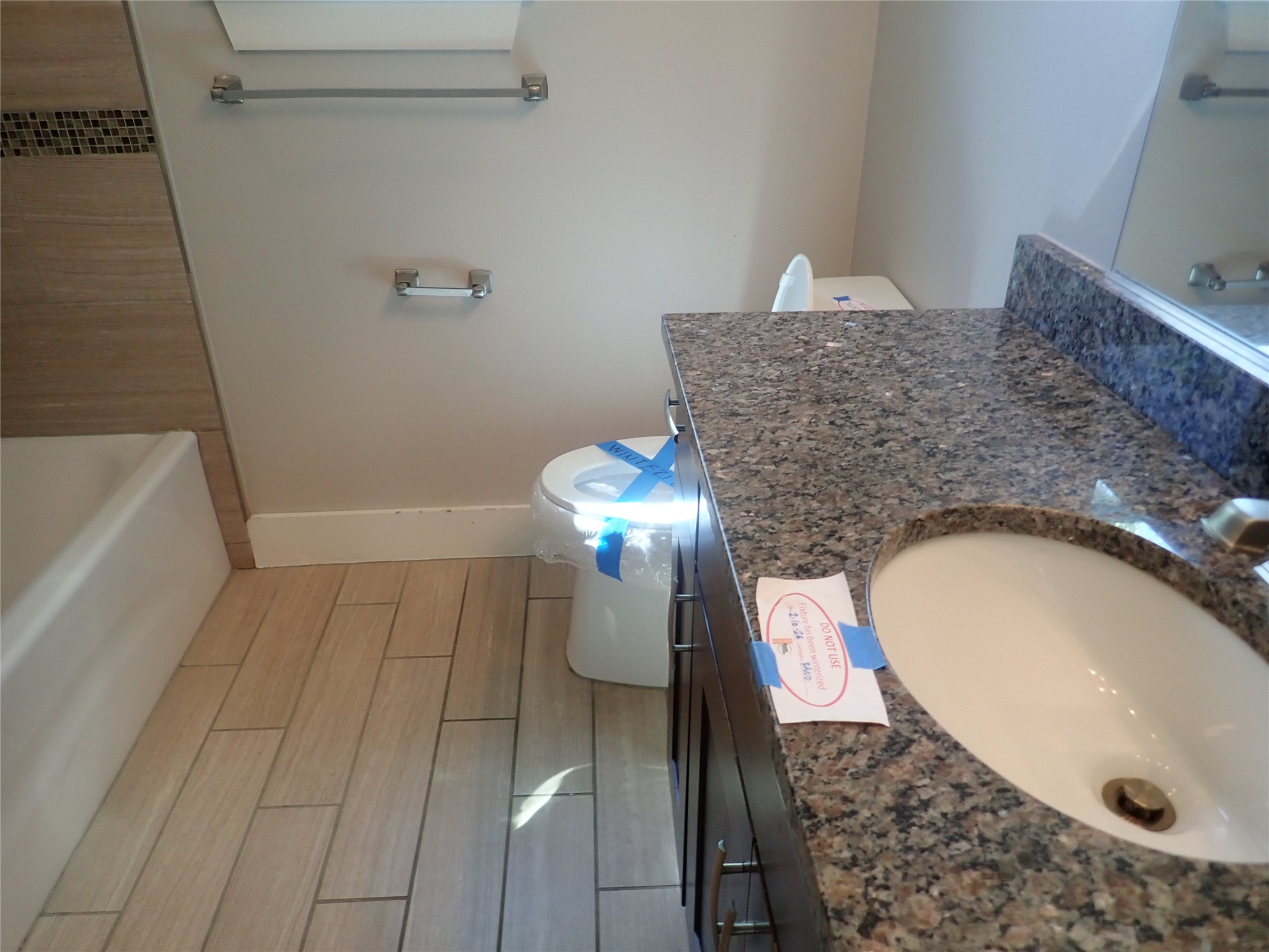 2912 East 14th Street, Unit A Austin, TX 78702 - Photo 21 of 27 Bathroom with vanity and wood finish floors