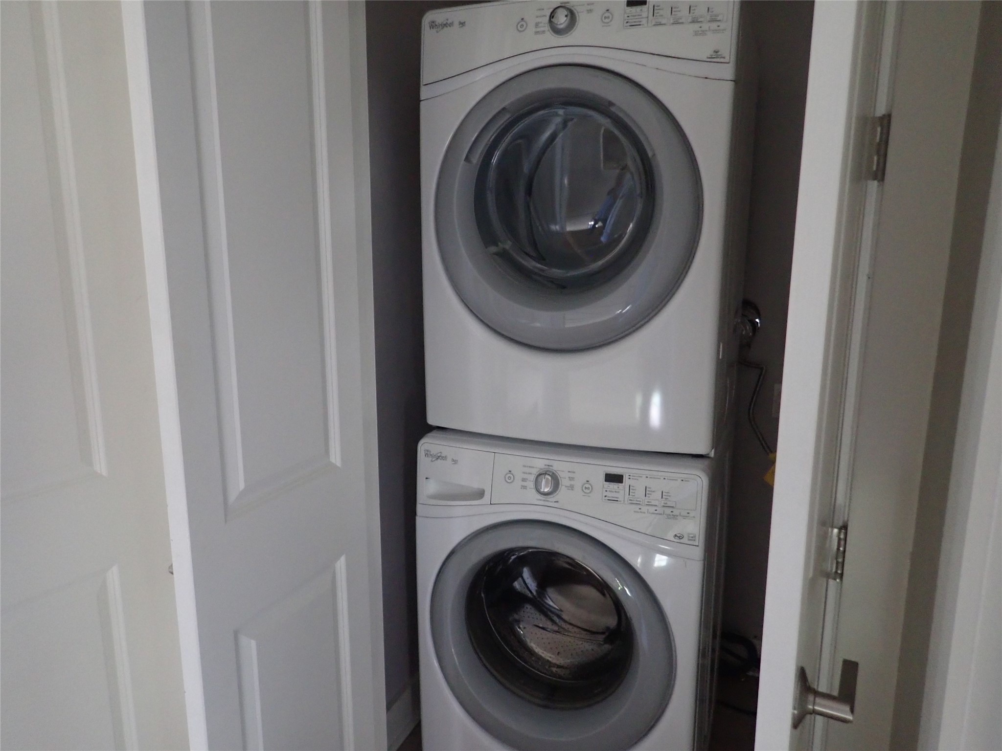 2912 East 14th Street, Unit A Austin, TX 78702 - Photo 22 of 27 Laundry area with stacked washer and clothes dryer