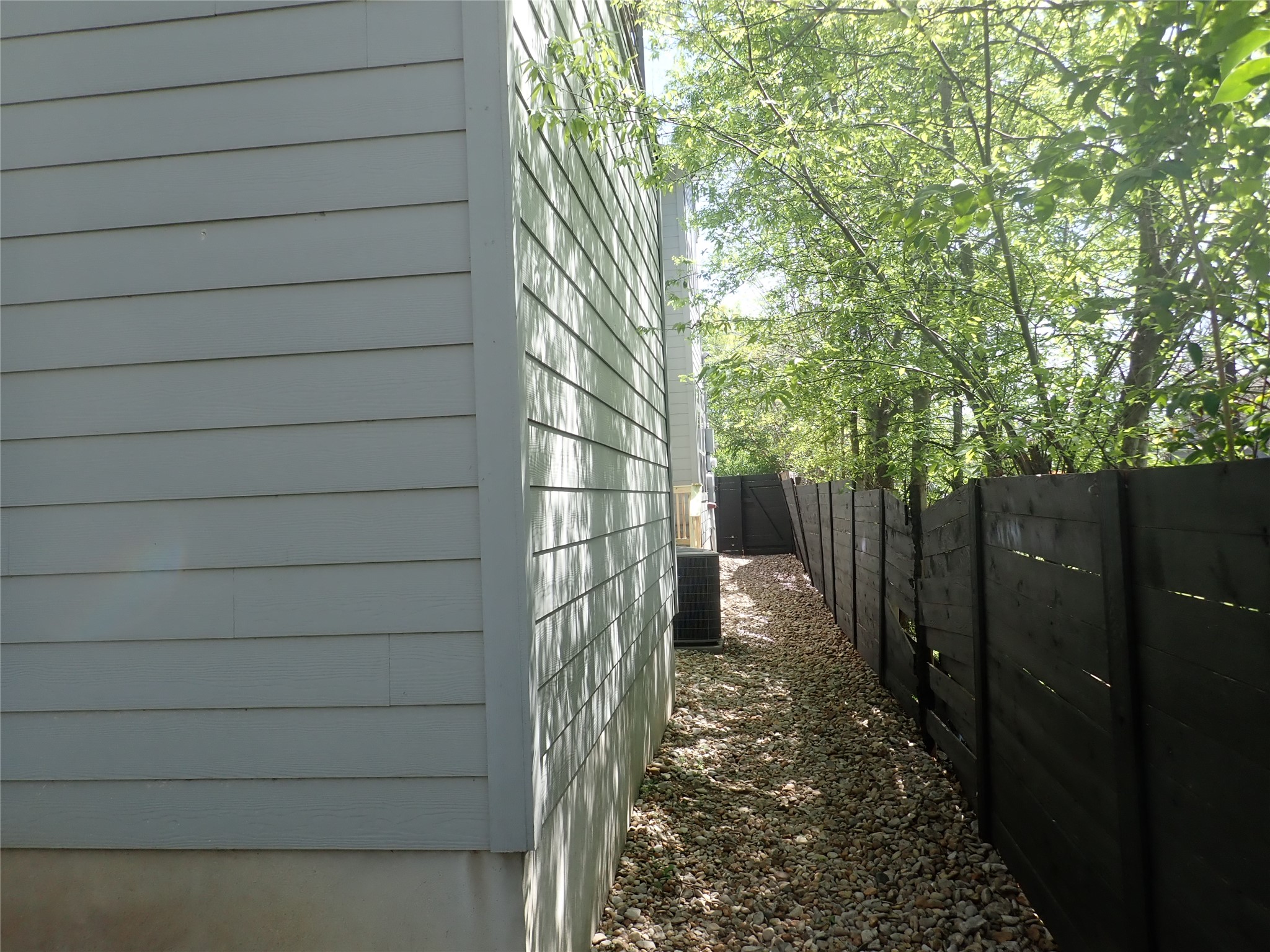 2912 East 14th Street, Unit A Austin, TX 78702 - Photo 3 of 27 View of side of home with a fenced backyard
