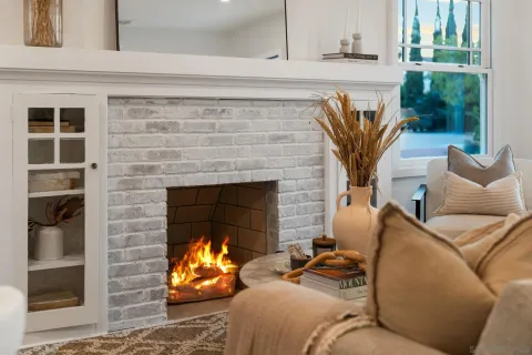 a living room with furniture and a fireplace