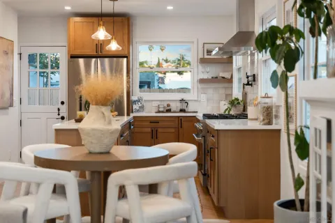 a dining room with furniture and window