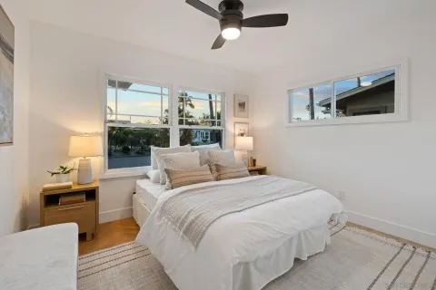 a bedroom with a bed and window