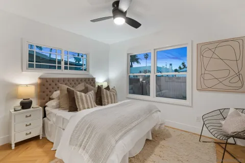 a bedroom with a bed and a chair