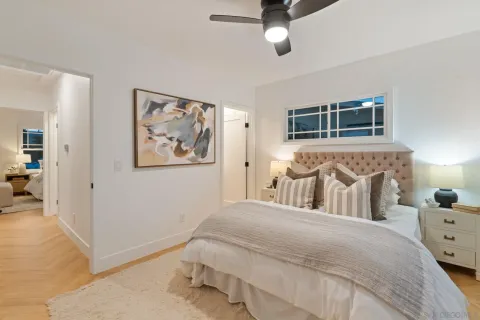 a bedroom with double bed and a window