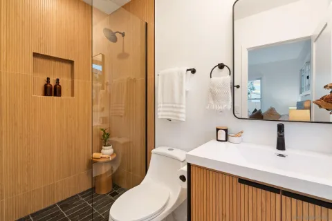 a bathroom with a sink toilet and shower