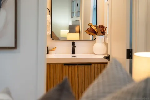 a bathroom with a sink and a mirror