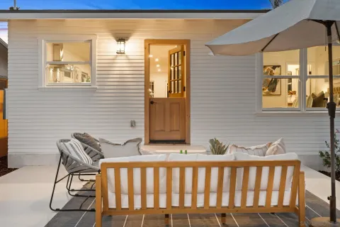 a balcony view with a seating space