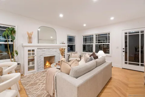 a living room with furniture window and a fireplace