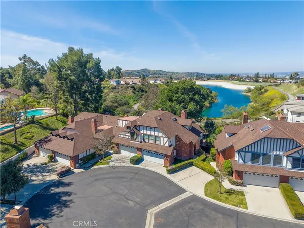 an aerial view of a house with outdoor space and street view