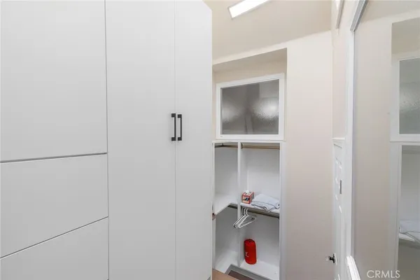 a bedroom with a bed and a cabinets