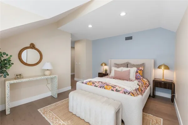 a bathroom with a granite countertop sink a mirror and a shower