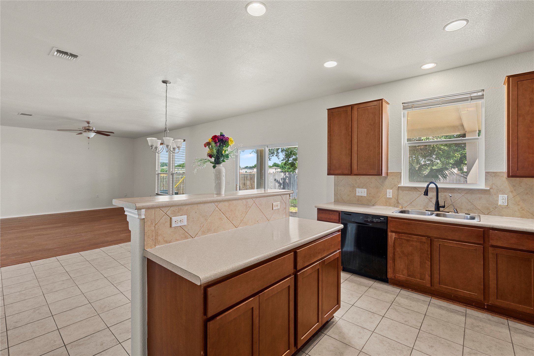 8613 Capitol View Drive Austin, TX 78747 - Photo 23 of 33 A well-lit kitchen with ample counter space and an open view to the living area.