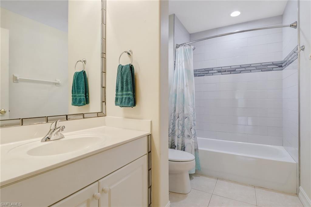 849 Carrick Bend Circle, Unit 202 Naples, FL 34110 - Photo 16 of 20 a bathroom with a sink toilet and shower