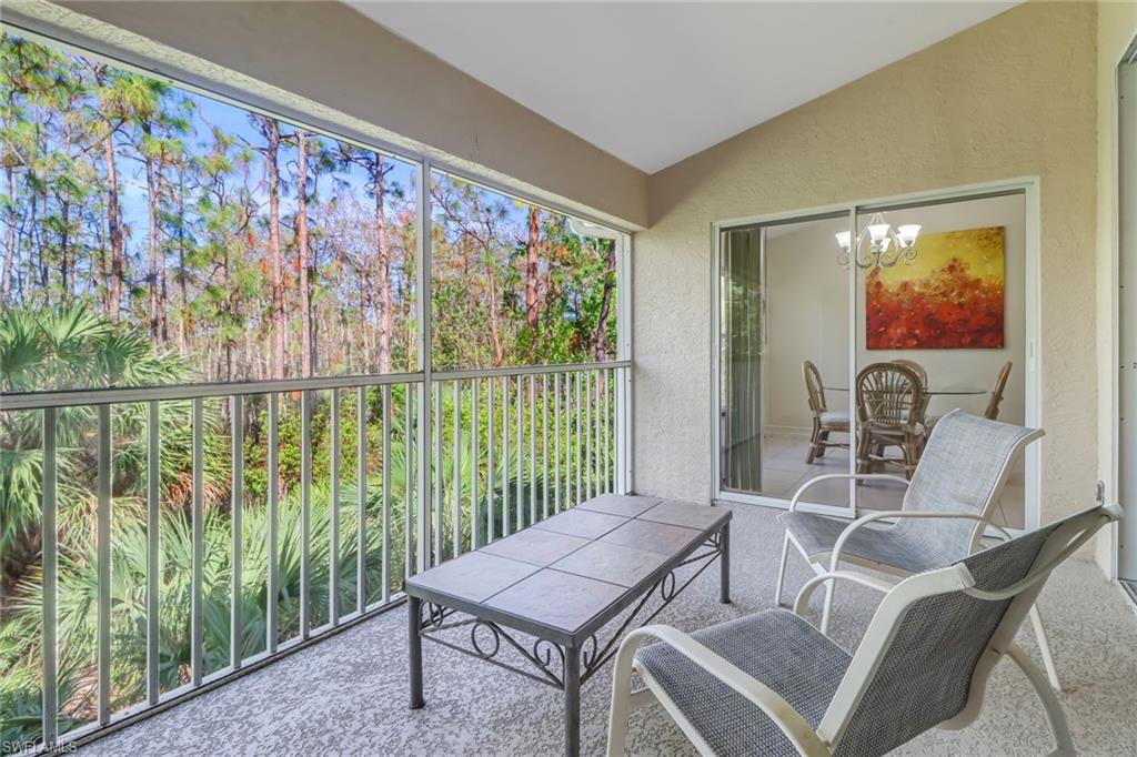849 Carrick Bend Circle, Unit 202 Naples, FL 34110 - Photo 18 of 20 a outdoor living space with furniture