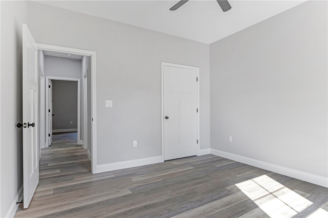 1115 Marshall Road Anderson, SC 29626 - Photo 28 of 35 Gleaming wood-look floors complement clean-lined modern architecture in this versatile secondary bedroom.