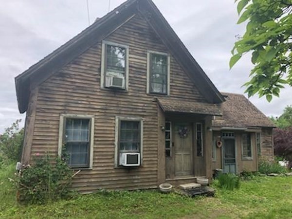 1007 Petersham Road Hardwick, MA 01037 - Photo 15 of 33 a view of brick house with small yard plants and large tree