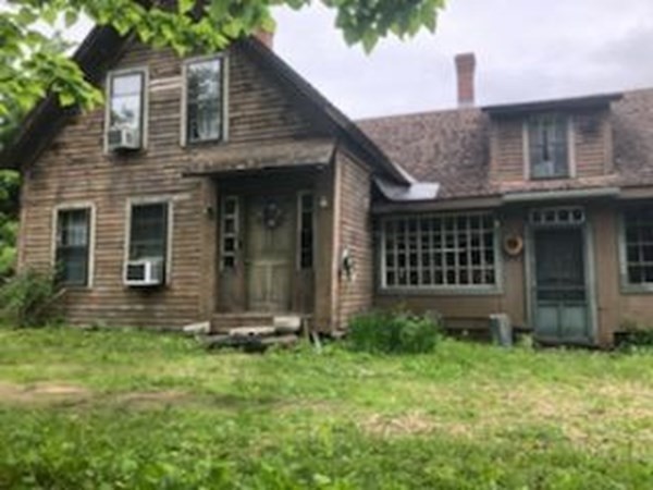 1007 Petersham Road Hardwick, MA 01037 - Photo 2 of 33 a front view of a house with garden