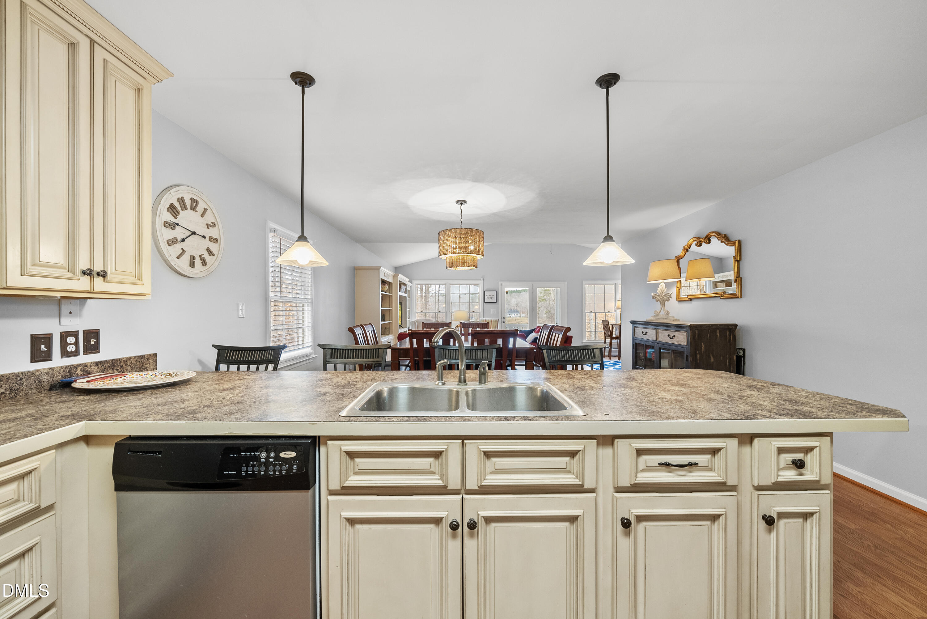303 Hidden Hills Road Roxboro, NC 27574 - Photo 18 of 39 a kitchen with kitchen island granite countertop a stove a sink a counter space and a center island