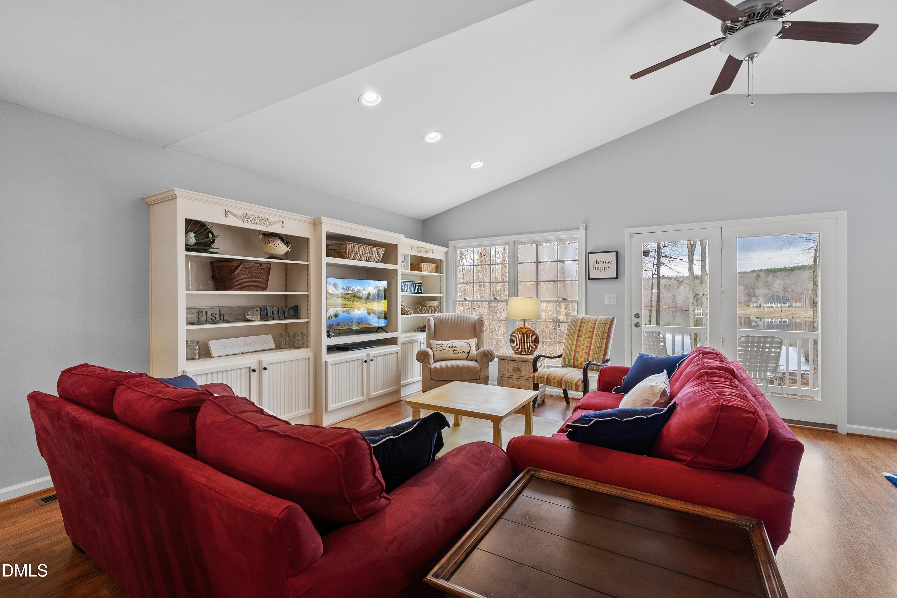 303 Hidden Hills Road Roxboro, NC 27574 - Photo 20 of 39 a living room with furniture and a book shelf