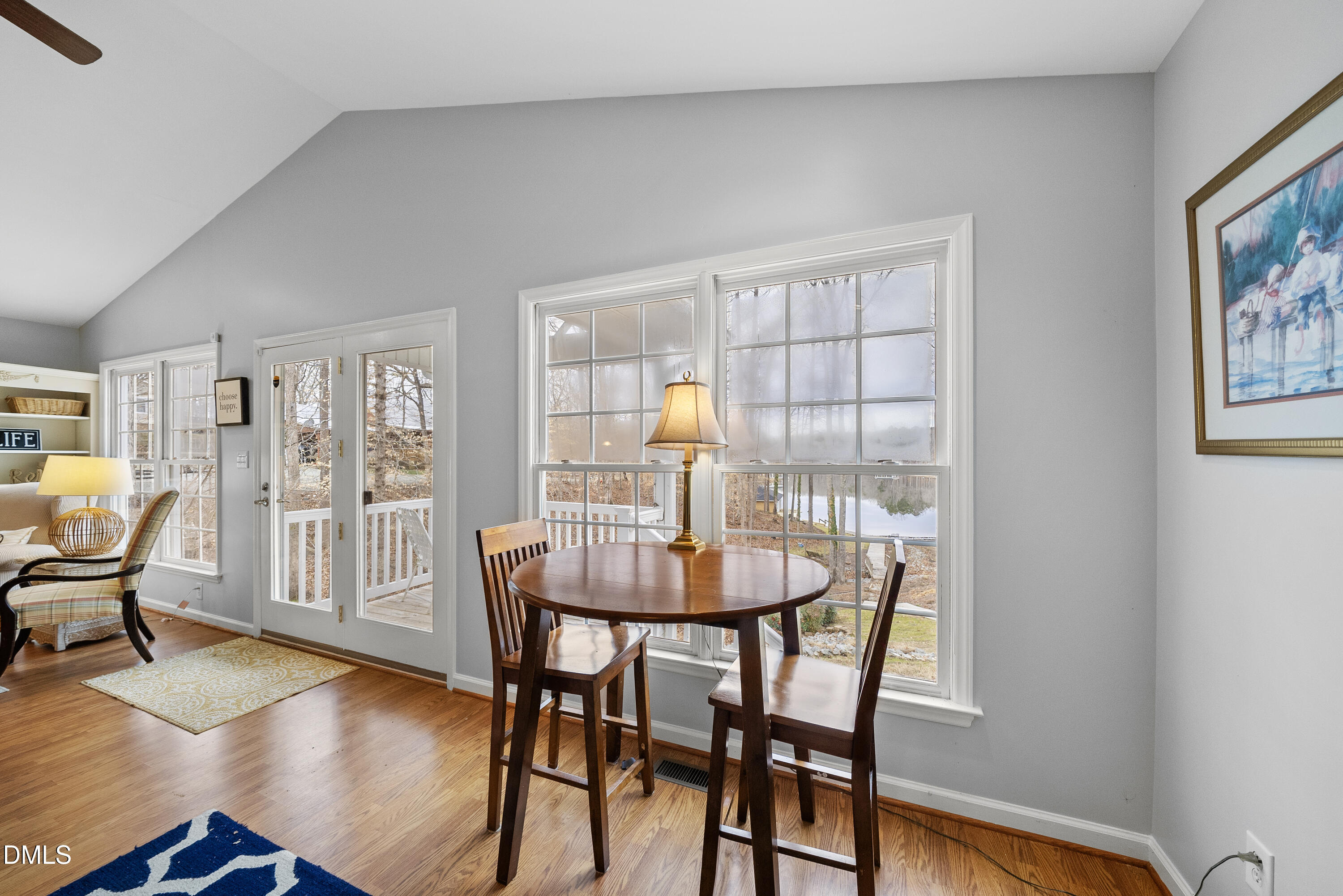 303 Hidden Hills Road Roxboro, NC 27574 - Photo 22 of 39 a dining room with furniture and wooden floor