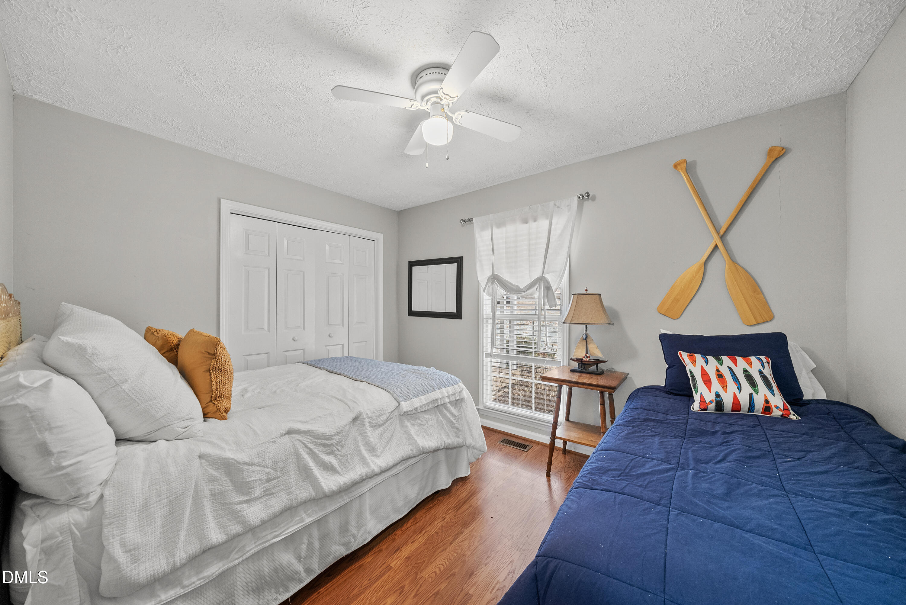 303 Hidden Hills Road Roxboro, NC 27574 - Photo 28 of 39 a bedroom with a bed and a chandelier