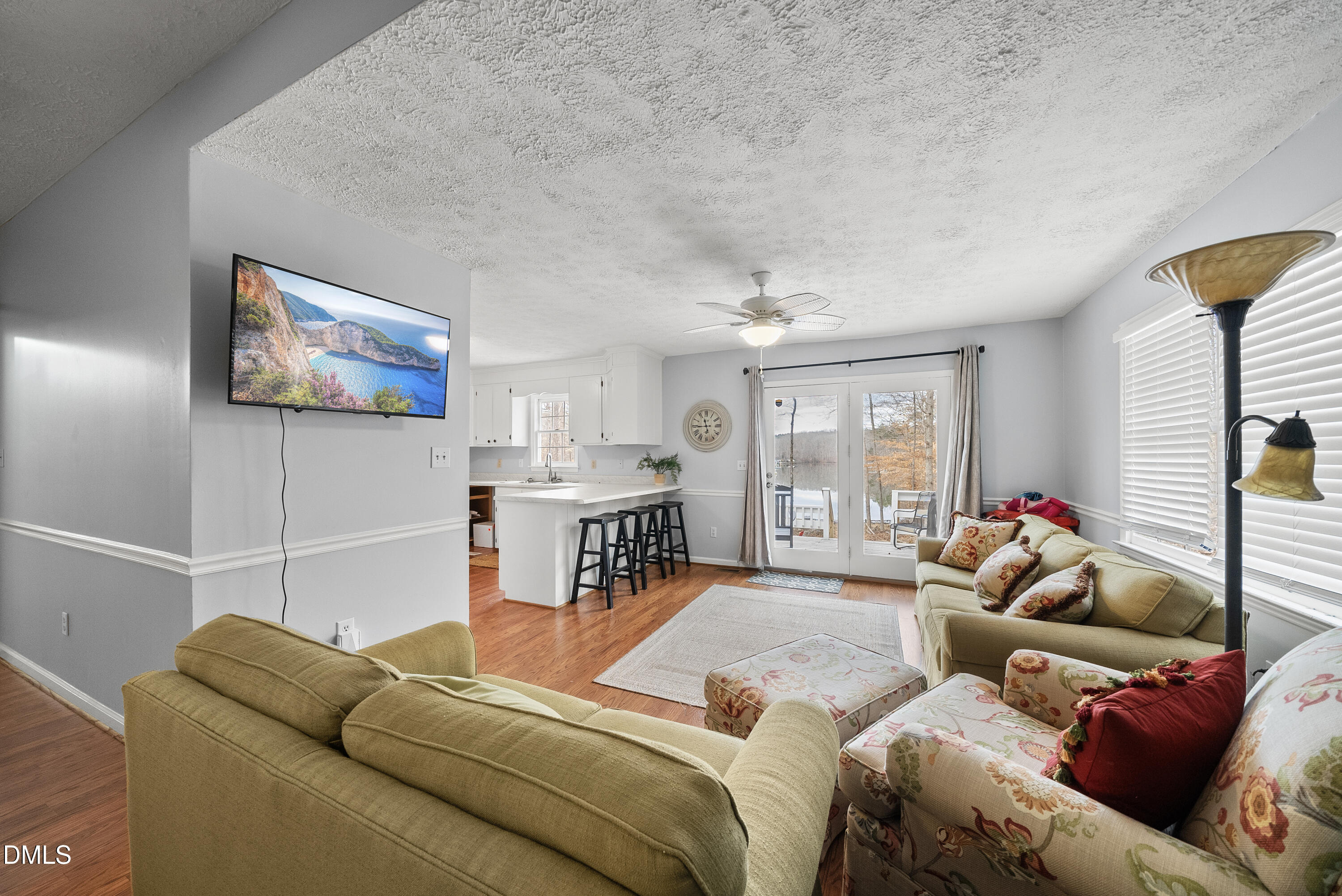 303 Hidden Hills Road Roxboro, NC 27574 - Photo 33 of 39 a living room with furniture and a flat screen tv