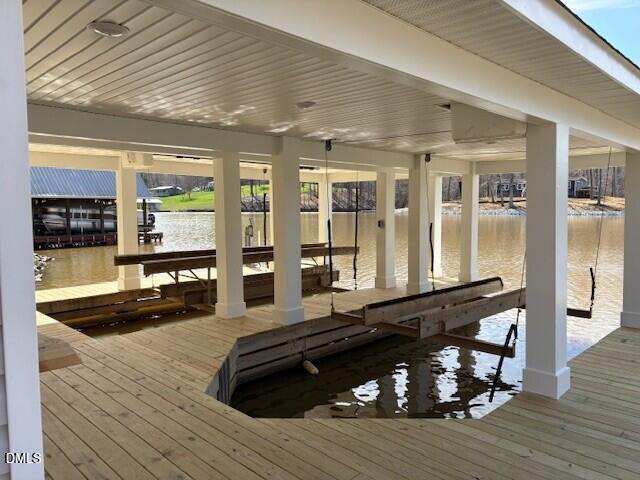 303 Hidden Hills Road Roxboro, NC 27574 - Photo 4 of 39 a room with lots of wooden furniture and glass door