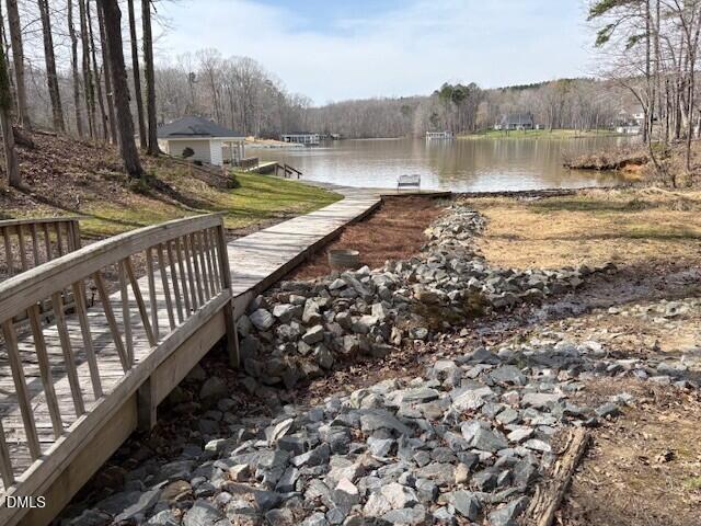 303 Hidden Hills Road Roxboro, NC 27574 - Photo 5 of 39 a view of a yard with wooden fence
