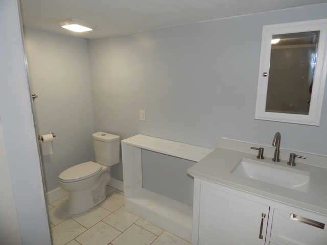 177 Seneca Creek Road Seneca, SC 29678 - Photo 16 of 26 This bathroom features a contemporary vanity and a functional toilet.