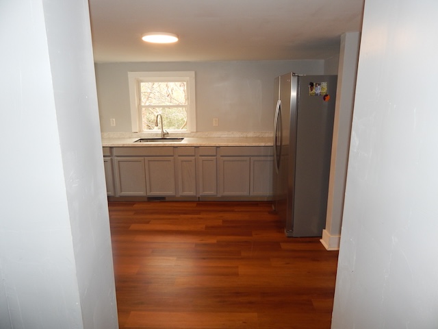 177 Seneca Creek Road Seneca, SC 29678 - Photo 18 of 26 Bright and inviting, this kitchen features rich hardwood flooring and sleek countertops.