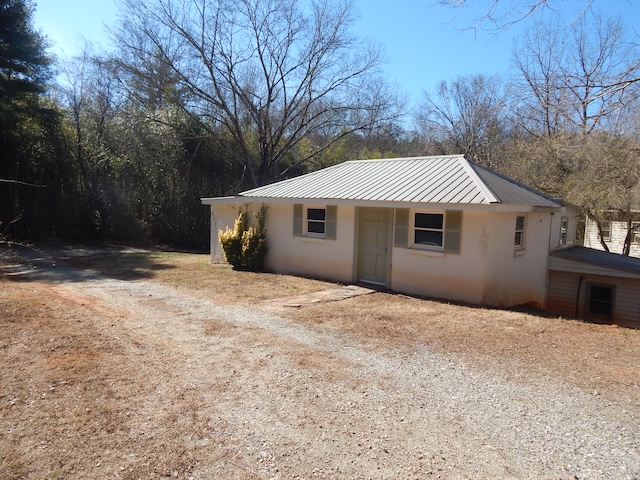 177 Seneca Creek Road Seneca, SC 29678 - Photo 2 of 26 This quaint residence offers a serene escape with its private setting and welcoming facade.