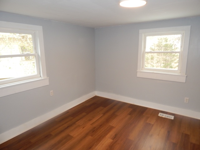 177 Seneca Creek Road Seneca, SC 29678 - Photo 24 of 26 This inviting bedroom features rich hardwood flooring and abundant natural light through bright windows.
