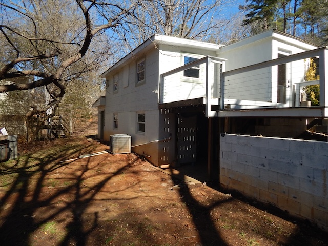 177 Seneca Creek Road Seneca, SC 29678 - Photo 6 of 26 This property features a multi-level structure with an elevated deck overlooking a natural landscape.