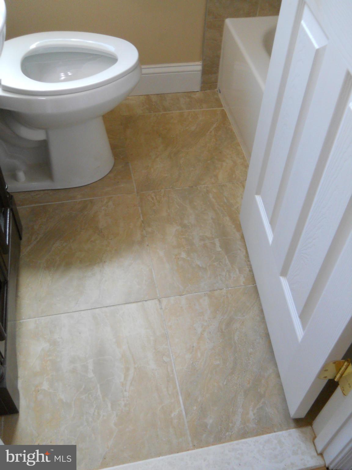 6940 Broening Road Baltimore, MD 21222 - Photo 14 of 22 Upstairs Bath Flooring