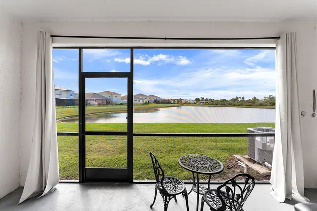 a view of a city from a dining room with large windows
