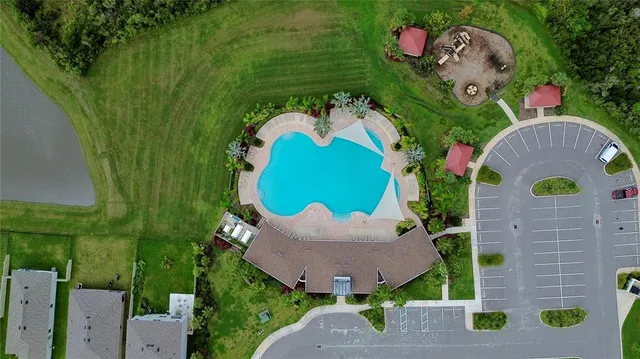 an aerial view of a house with a garden and outdoor space