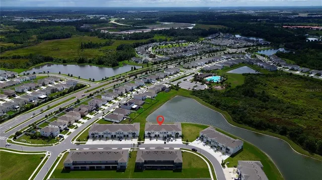 an aerial view of a house with a garden
