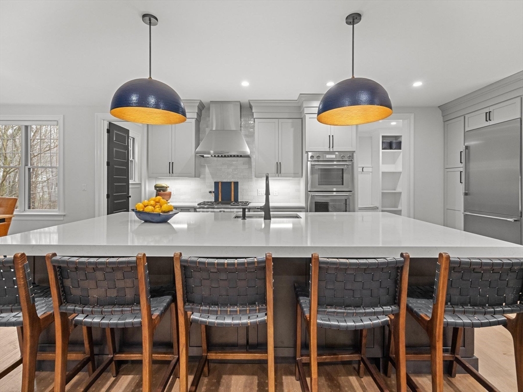 15 Quick Farm Road Westborough, MA 01581 - Photo 14 of 40 a kitchen with a dining table and chairs