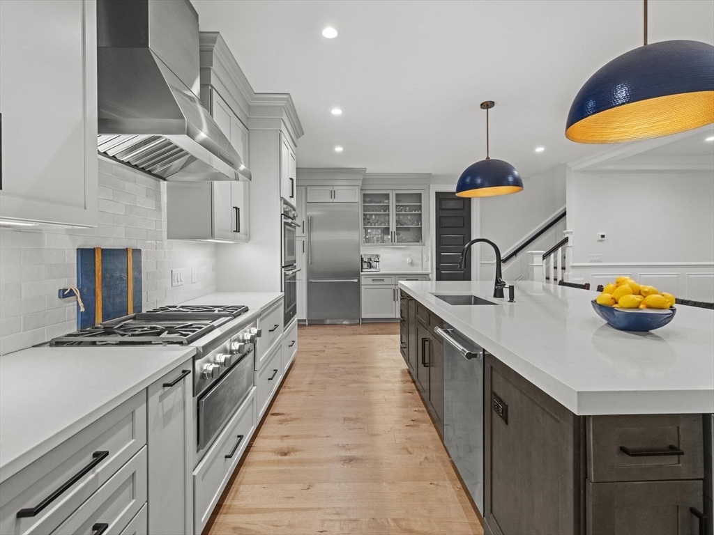 15 Quick Farm Road Westborough, MA 01581 - Photo 17 of 40 a kitchen with stainless steel appliances a sink a stove and a wooden floors