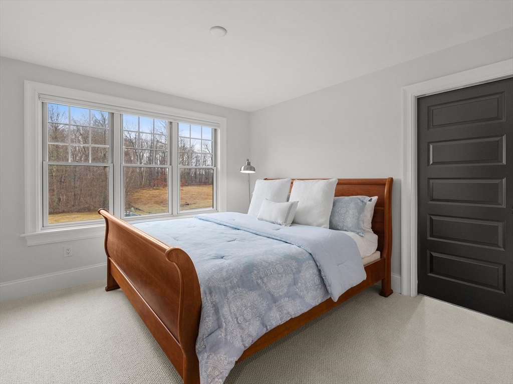 15 Quick Farm Road Westborough, MA 01581 - Photo 27 of 40 a bed sitting in a bedroom next to a window