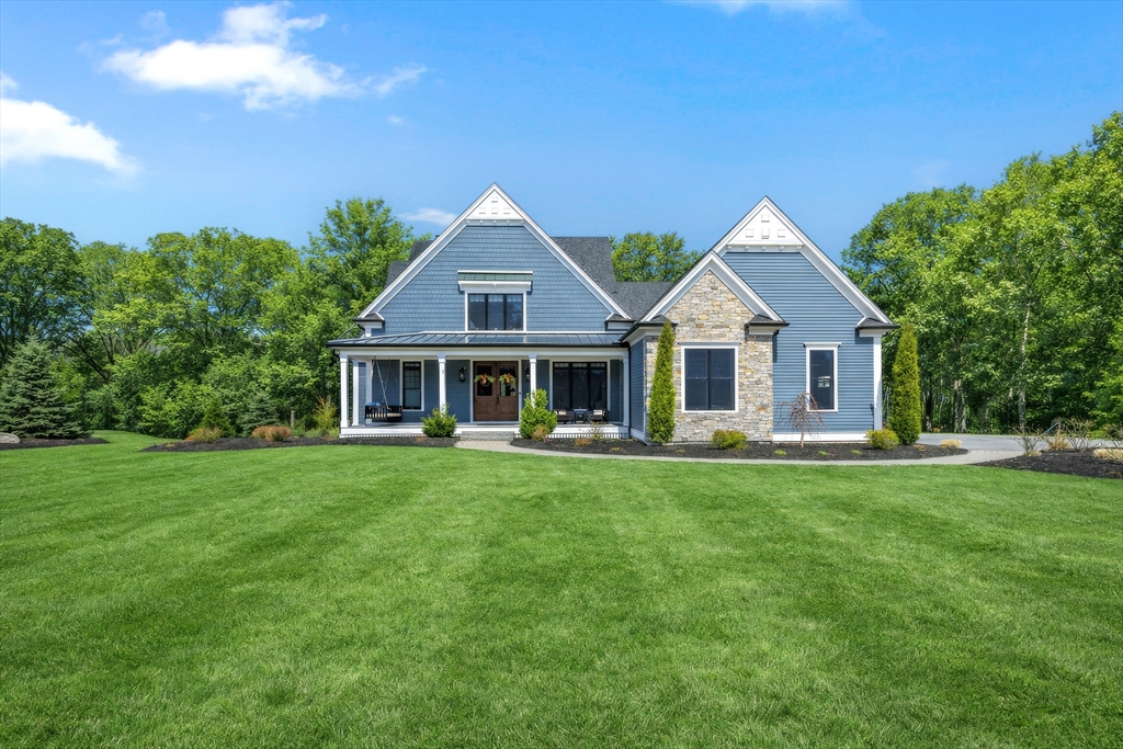 15 Quick Farm Road Westborough, MA 01581 - Photo 39 of 40 a front view of a house with a garden and porch