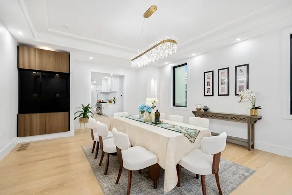 a view of a dining room with furniture and wooden floor
