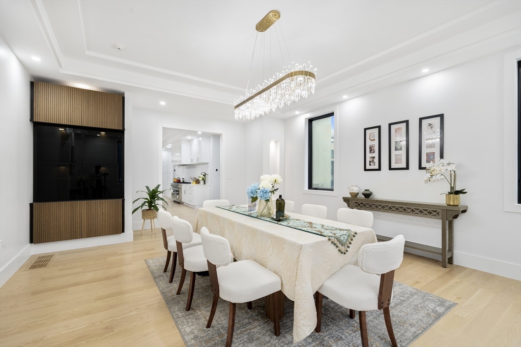 197 Woburn Street Lexington, MA 02420 - Photo 12 of 42 a view of a dining room with furniture and wooden floor
