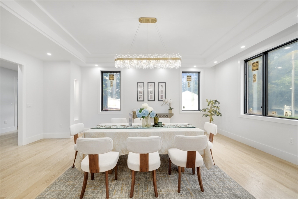 197 Woburn Street Lexington, MA 02420 - Photo 13 of 42 a view of a a dining room with furniture window and wooden floor