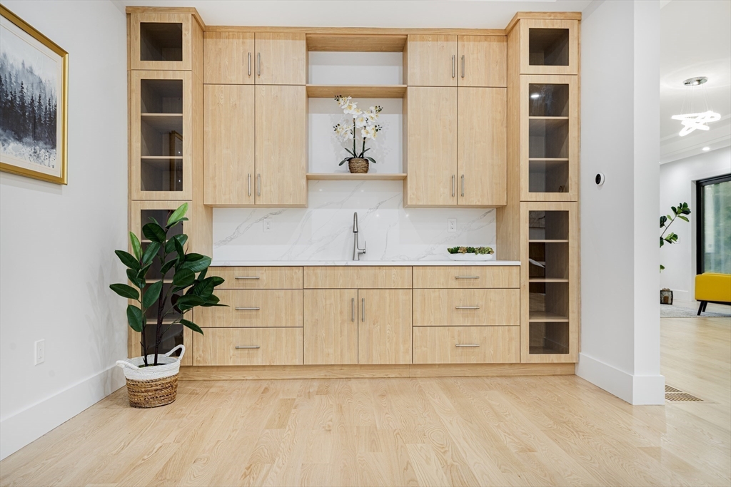 197 Woburn Street Lexington, MA 02420 - Photo 15 of 42 a view of cabinets a potted plant and a window