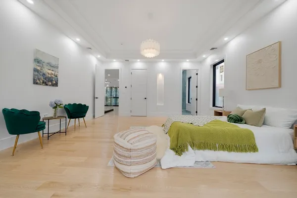 a living room with furniture and a lamp