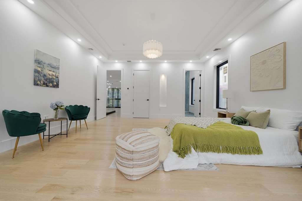 197 Woburn Street Lexington, MA 02420 - Photo 21 of 42 a living room with furniture and a lamp